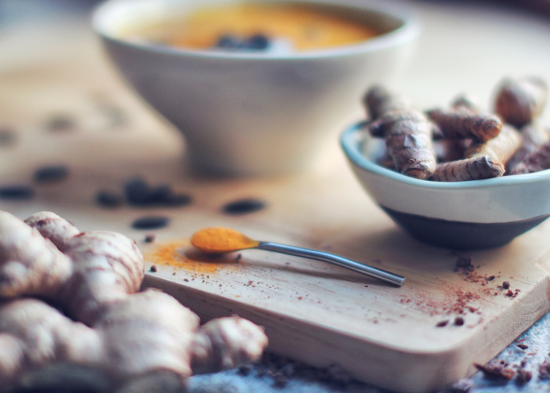 Bone broth simmering with aromatic vegetables