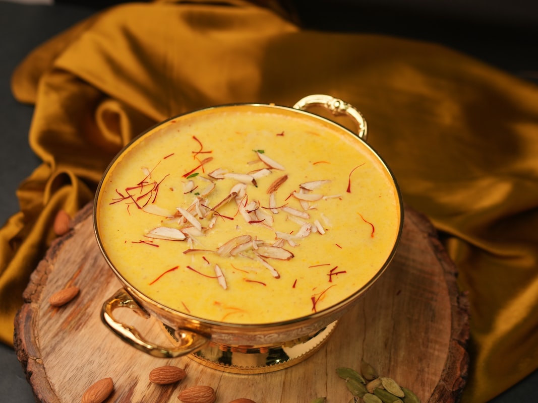 Collection of fresh anti-inflammatory ingredients including turmeric, ginger, and leafy greens